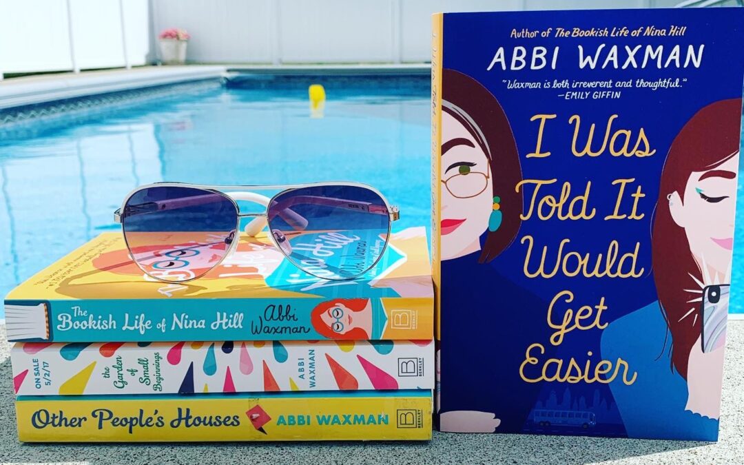 Swimming pool background with Abbi Waxman books displayed in front