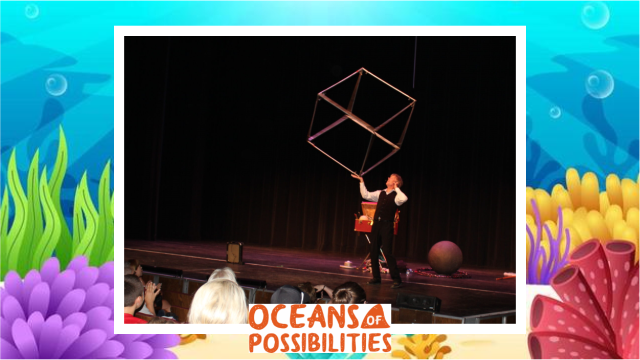 Juggler Brian Wendling on stage at Pittsburg's Memorial Auditorium. Graphic ocean background with "Oceans of Possibilities"