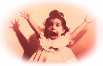 Black and white photo of young girl with her hands up in the air and she appears to be screaming. As in, "you scream, we scream, we all scream for ice cream"