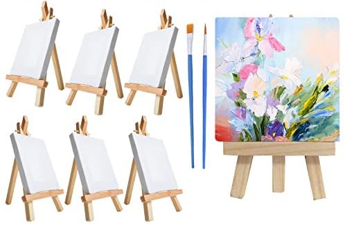 Blank mini canvases on easels, with one example painted with florals