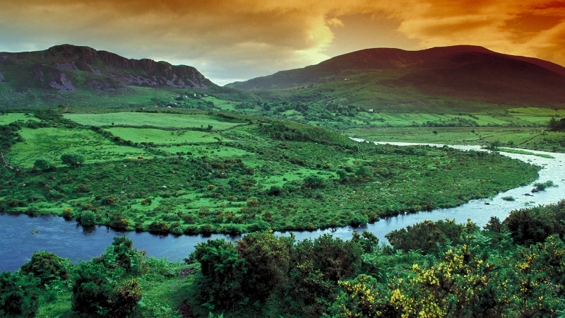 Beautiful panoramic photo of the Irish countryside, with mountains and a blue lake