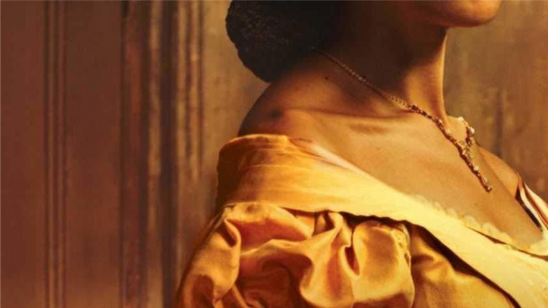 Stylized from the cover of the book: Yellow Wife by Sadeqa Johnson. Woman's shoulders wearing a yellow gown.